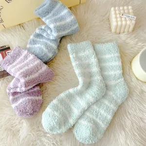 Cozy fuzzy striped coral fleece socks detail view, thick warm winter sleep socks for women.