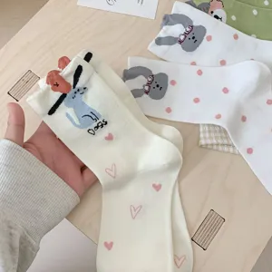 Cute cartoon dog mid-tube socks with pink hearts and 3D animal details for women spring wear.
