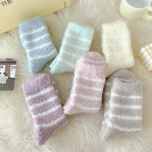 Cozy striped coral fleece women socks, thick warm winter sleep socks in various pastel colors.