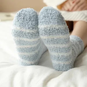 Cozy blue white striped fuzzy coral fleece socks detail shot, warm winter sleep socks for women.
