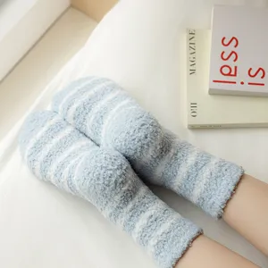 Comfortable thick striped coral fleece socks for women, cozy winter sleep socks detail view.