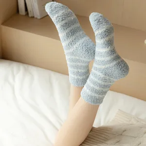 Cozy striped fuzzy coral fleece socks detail view, thick warm sleep socks for women.