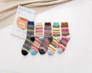 Detailed shot of retro ethnic pattern wool socks featuring vibrant multi-color wool knit designs.