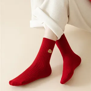 Red cotton socks for women, mid-calf ribbed knit design with cute cookie embroidery.