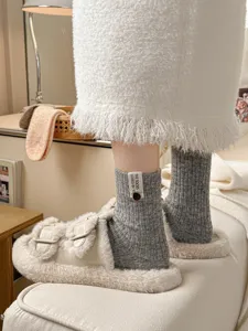 Thick wool slouch socks with fuzzy slippers detail view, warm and cozy retro winter style knit socks.