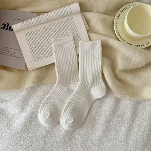 Cozy solid white ribbed knit wool socks detailed close-up shot, soft winter warm floor socks.