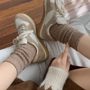 Cozy wool knit piled socks for women, thick warm winter floor socks with retro sneakers detail.