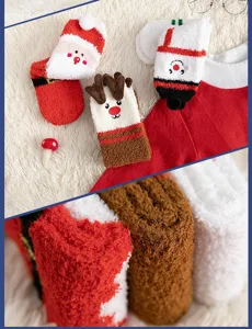 Detail view of cute Christmas coral fleece socks with embroidered elk and Santa designs.