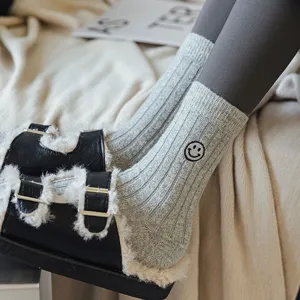 Cozy knit crew socks for women, thick warm winter socks with cute smiley embroidery.