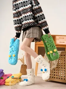 Thick lamb fleece floor socks with cute cartoon embroidery and fluffy balls for warm indoor wear.