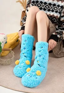 Thick fuzzy plush floor socks for women, warm winter cozy sleep socks with cute cartoon embroidery.