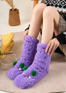 Cozy thick purple fluffy fleece winter home socks with cute green pom pom cartoon design.