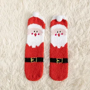 Fluffy coral fleece Christmas socks with cute Santa Claus design, warm and cozy for indoor home wear.