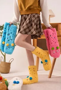 Fluffy fleece floor socks with cute cartoon embroidery and warm thick design for home wear.