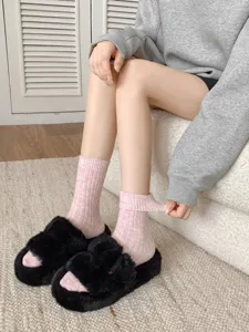 Comfortable women warm wool cashmere slouchy knit socks paired with fluffy home plush slippers.