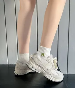 Women's cotton socks with green embroidered H letter, soft knit fabric and casual ankle design.