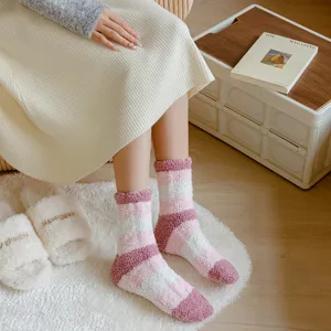 Women's winter cozy striped coral fleece fuzzy socks for warm indoor home floor wear.