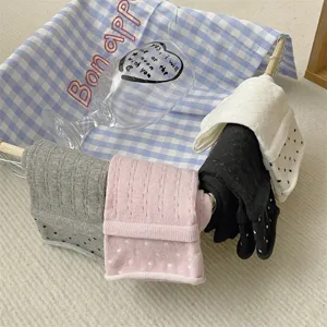 Detailed view of summer women's thin mesh mid-tube socks featuring cute polka dots and rolled edges.