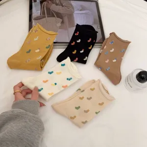 Japanese style cute heart pattern cotton mid-tube socks with rolled edge design for women.
