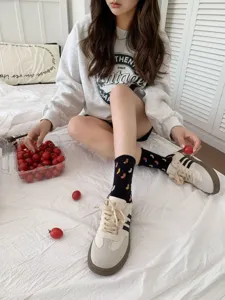 Japanese style cute mid-calf socks paired with casual retro sneakers and cozy grey sweatshirt.