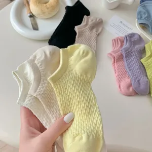 Close-up detail of women's mesh ankle socks in summer, breathable candy colors style.