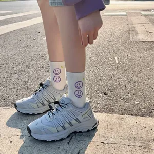 Women casual mid-tube socks featuring cute purple smiley face design, comfortable cotton.