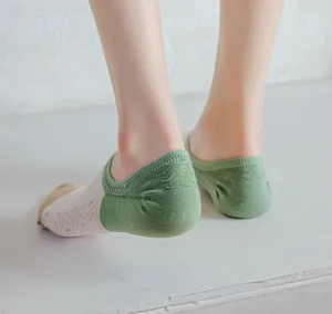 Detail view of women's shallow cut invisible boat socks with mesh breathable pattern.