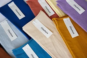 Detailed view of colorful knitted socks with brand labels, soft texture and multiple color options.