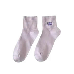 Comfortable women's short cotton socks in soft purple with cute blue cuff embroidery.