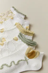 Detailed shot of cute women's mesh short socks featuring floral and tulip embroidery designs.