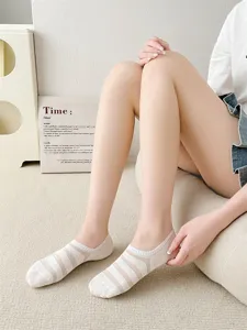 Detail view of women's low-cut boat socks with delicate striped texture and invisible fit.
