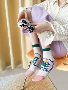 Spring and summer women's mid-calf socks with cute floral patterns and knitted English letters.