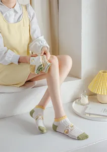 Detailed view of women ruffles mesh low-cut boat socks, sweet floral short socks for spring.