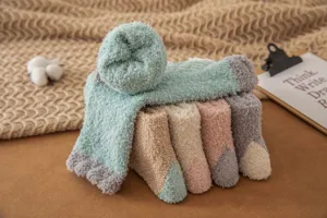 Cozy coral fleece fluffy socks for women, soft warm winter sleep socks with anti-slip grips.