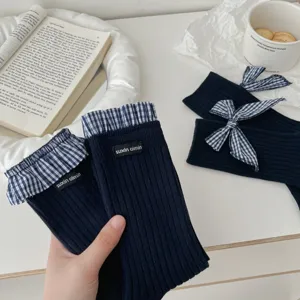 Dark blue ribbed socks with blue checkered ruffles and cute bow detail. Soft cotton style.