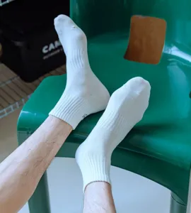 White cotton crew socks detail shot, casual retro style daily wear breathable athletic socks.