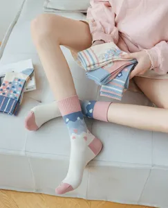 Cute women mid-tube socks with spring pastel blue and pink cloud floral embroidery designs.