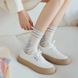 Spring women's mid-tube socks featuring cute tulip flower embroidery and lovely pink blue stripes.