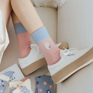 Spring women's mid-calf socks featuring cute tulip embroidery and trendy pink-blue color blocking.