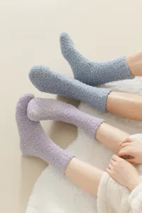 Soft cozy fleece sleep socks detail shot, thick warm fuzzy winter floor socks for women.