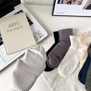 Detail shot of men's breathable mesh short socks, showing texture and multiple color options.