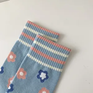 Blue floral striped mid tube socks detail showcasing cute knit pattern and soft fabric.