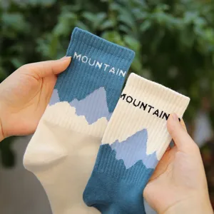 Knit cotton mid-tube socks featuring mountain patterns and stylish color block design for daily wear.