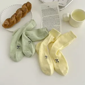 Cute bow embroidered mesh socks detail view, breathable summer women hosiery product display.