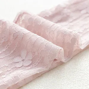 Close-up detail of sheer floral lace slouch socks in soft pink, breathable mesh texture.