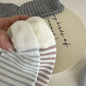 Detailed close-up of women striped mid-calf socks showing soft knit texture and pattern.