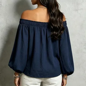 Back view detail of the navy blue off-the-shoulder elastic ruffled long sleeve blouse.