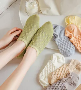Close-up of breathable mesh women boat socks with cute textured design, comfortable daily wear.
