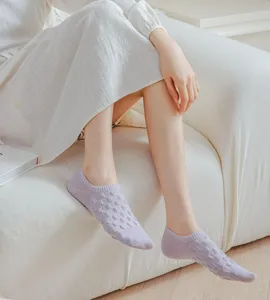 Detail shot of sweet purple mesh boat socks, featuring breathable fabric and everyday style.