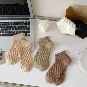 Close-up detail of breathable mesh short socks in neutral colors, stylish everyday wear.
